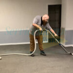 ServiceMaster by LoveJoy employee cleaning the carpet